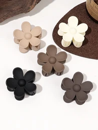  Floral hair clips in various colors including black, white, beige, brown, and gray. The clips feature a simple flower design with petals.
