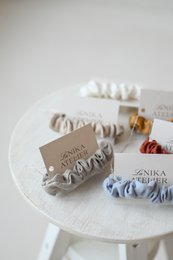 Soft, linen scrunchies in a variety of neutral and pastel colors. Handmade with natural materials.