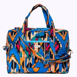Large blue ikat print travel bag with colorful abstract pattern, suitable for weekend getaways.