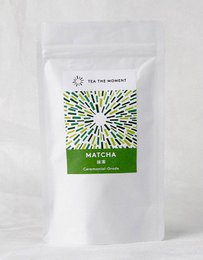  "Bright green ceremonial grade matcha powder, fine texture, vibrant color, premium quality tea"