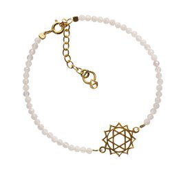 A delicate gold-tone charm bracelet featuring a heart chakra symbol and white beads, perfect for adding a touch of spiritual style to any outfit.