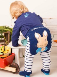  Navy blue leggings with white stripes, featuring a Peter Rabbit graphic. Suitable for babies and toddlers aged 0-4 years.