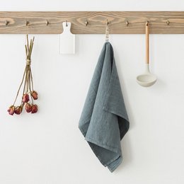  Blue linen kitchen towel with a soft, textured appearance. Made of high-quality linen material, suitable for drying dishes or hands in the kitchen.