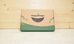  Green and brown shipping box with "Happysoaps" logo, designed to hold and ship soap products.