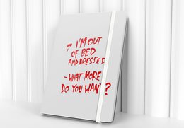 A5/A6 notebook with a tartan pattern featuring green and red squares on a dark background.