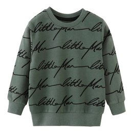 Cozy green pullover with all-over 'Little Man' text print, perfect for baby boys. Soft, comfortable knit fabric in a classic crew neck style. Available in sizes 2T to 7T.