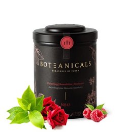 A dark, round tin containing Darjeeling black tea blended with rose blossom and raspberry. The tin has a red label and the tea leaves are visible through the transparent lid, along with some red rose petals.

The product is a Darjeeling black tea blend with rose blossom and raspberry. The key details that can be extracted from the image and product title are:

Colors: Black tea leaves, red rose petals
Materials: Metal tin container
Style: Round, dark-colored tin
Shapes: Round tin, rose petals
Ingredients: Darjeeling black tea, rose blossom, raspberry

This description provides enough information about the product's key attributes to enable semantic search for terms like "Darjeeling tea", "rose tea", "raspberry tea", and even more specific queries like "round black tea tin with rose".