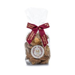 Assorted hazelnut chocolate pralines in a 100g or 170g package. The pralines are wrapped in a festive red ribbon with a holiday-themed label.