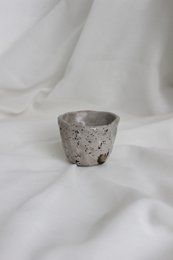 Glossy handmade ceramic cups in a minimalist, modern design. Features a simple, curved shape with a neutral color palette.