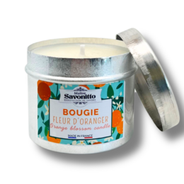 Tall, round orange blossom scented candle in a white container.