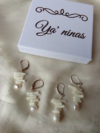  Elegant drop earrings featuring natural freshwater pearls in sterling silver or 14k gold filled settings.