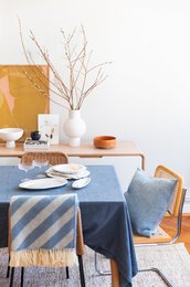  Blue and white striped wool blanket with tassels, suitable for use as a throw or couch cover.