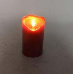  Red, tall, cylindrical candle with a flickering LED light.