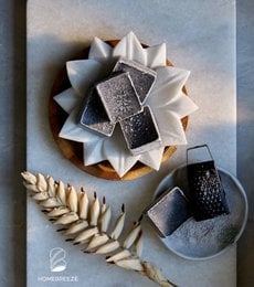 Cashmere perfume block, amber-colored, rectangular shape, textured surface, natural materials.