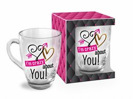 A white glass mug with the text "I'm crazy about you!" printed on it in a pink and black design. The mug is packaged in a pink and black gift box.