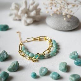  Amazonite bracelet with gold-tone chain and amazonite stones. Elegant and natural-looking cuff bracelet.