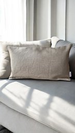 Genuine leather cushion in a deep burgundy color, with a rectangular shape and a textured leather surface.