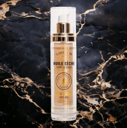  24K Gold Dry Oil in a 50ml spray bottle, containing 4 nourishing oils for the body.