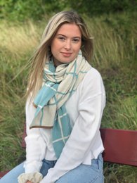 Soft, lightweight scarf in a seablue color with a plaid pattern. Made of a comfortable, breathable material suitable for all seasons.