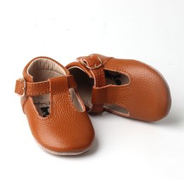 Brown leather baby shoes with flexible soles, available in sizes 17-22.