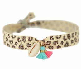 Leopard print anklet with tassel charm, made of coconut material.