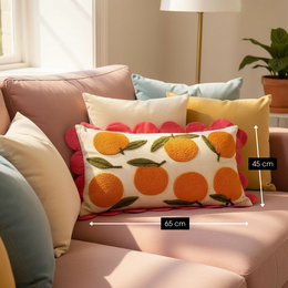  Decorative cushion with a pattern of oranges in shades of orange and pink on a cream background. The cushion has a rectangular shape and measures 65 cm long, 45 cm wide, and 10 cm high. It is made of cotton material.