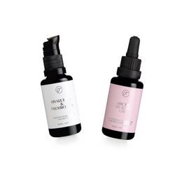 This skin care product pack includes a hyaluronic acid and probiotics serum and an arctic beauty oil. The serum and oil are packaged in clear glass bottles with black dropper lids. The bottles have simple, minimalist labels with the product names.