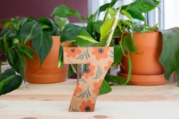  Colorful, patterned pencil holder in the shape of the number 7, made of ceramic material with a green leaf accent.