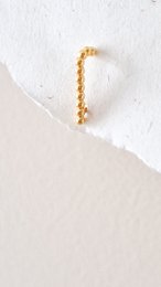  Gold beaded chain statement earring, white pearl drop, elegant minimalist design, luxury jewelry accessory.