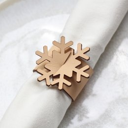 Natural leather napkin rings with snowflake design, set of 4.