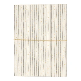 A5 size notebook with a dotted pattern cover in a cream and beige color scheme.