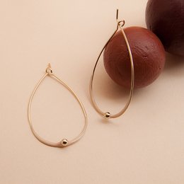 Elegant gold-tone hoop earrings with a sleek, minimalist design. Available in a variety of chic color options to complement any outfit.