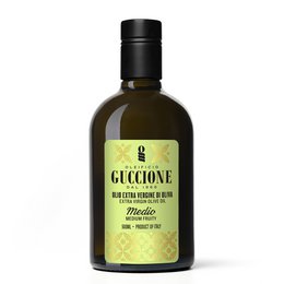 Premium extra virgin olive oil in a green glass bottle with a green and white label featuring a geometric pattern design.