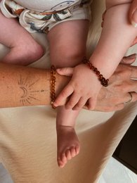 Amber baby/child bracelet set, featuring 12 bracelets in a variety of amber colors and shapes, suitable for infants and young children.