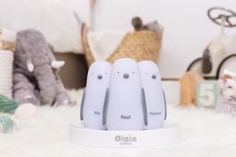 White induction charging night light with 3 penguin-shaped lights, suitable for kids' rooms.
