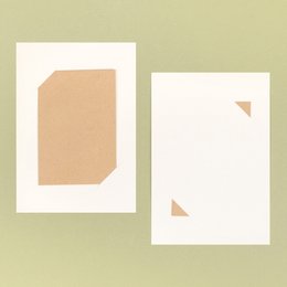 Ivory-colored support card with a simple, minimalist design featuring a small floral accent.
