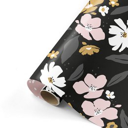 Rolls of wrapping paper with a floral pattern in shades of pink, yellow, and black. The paper features large flowers with petals and centers, as well as smaller floral accents.