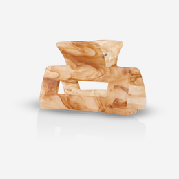 Quad sandstorm hair clip made of beige and brown marbled resin material with a unique geometric shape.