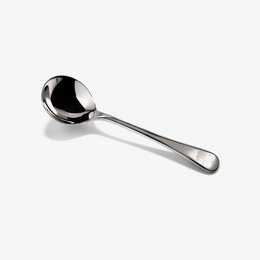 Stainless steel cupping spoon for coffee or tea preparation. Smooth, rounded bowl shape for scooping and serving.