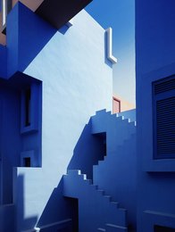 Vibrant blue and white abstract painting with geometric shapes and shadows, available in multiple sizes.