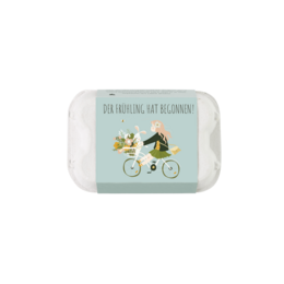  Egg box with 6 flower marbles in spring colors, featuring a whimsical illustration of a rabbit and horse riding bicycles. Ideal for planting seeds and celebrating the arrival of spring.