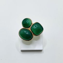 Adjustable gold-tone ring featuring three green agate gemstones in a statement design.