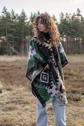 Alpaca poncho with native pattern in green, orange, and blue colors. Made of soft, warm alpaca wool. Ideal for cool weather and outdoor activities.