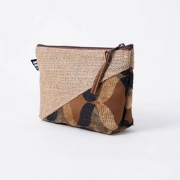 Beige and brown canvas toiletry bag with zipper closure and leather accents.