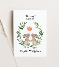 Bunny kisses, Easter wishes, A6 card with floral wreath and rabbit illustration.