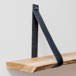  Recycled vegan wall shelf made from repurposed fire hoses in various colors including blue, red, yellow, and black.