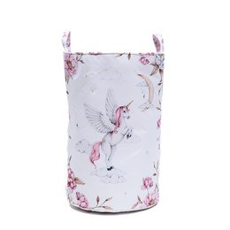 A large, round fabric basket with a white background and pink and purple unicorn designs. The basket has handles and a pink trim around the top.