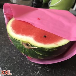 Reusable freezer bag in a variety of vibrant colors, perfect for storing and preserving fresh watermelon slices.
