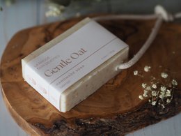Gentle oat soap on a rope, rectangular shape, white color, natural ingredients, handmade appearance.