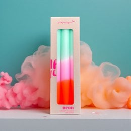 Tall, dip-dyed candles in a spring sorbet color palette of mint green and neon orange.